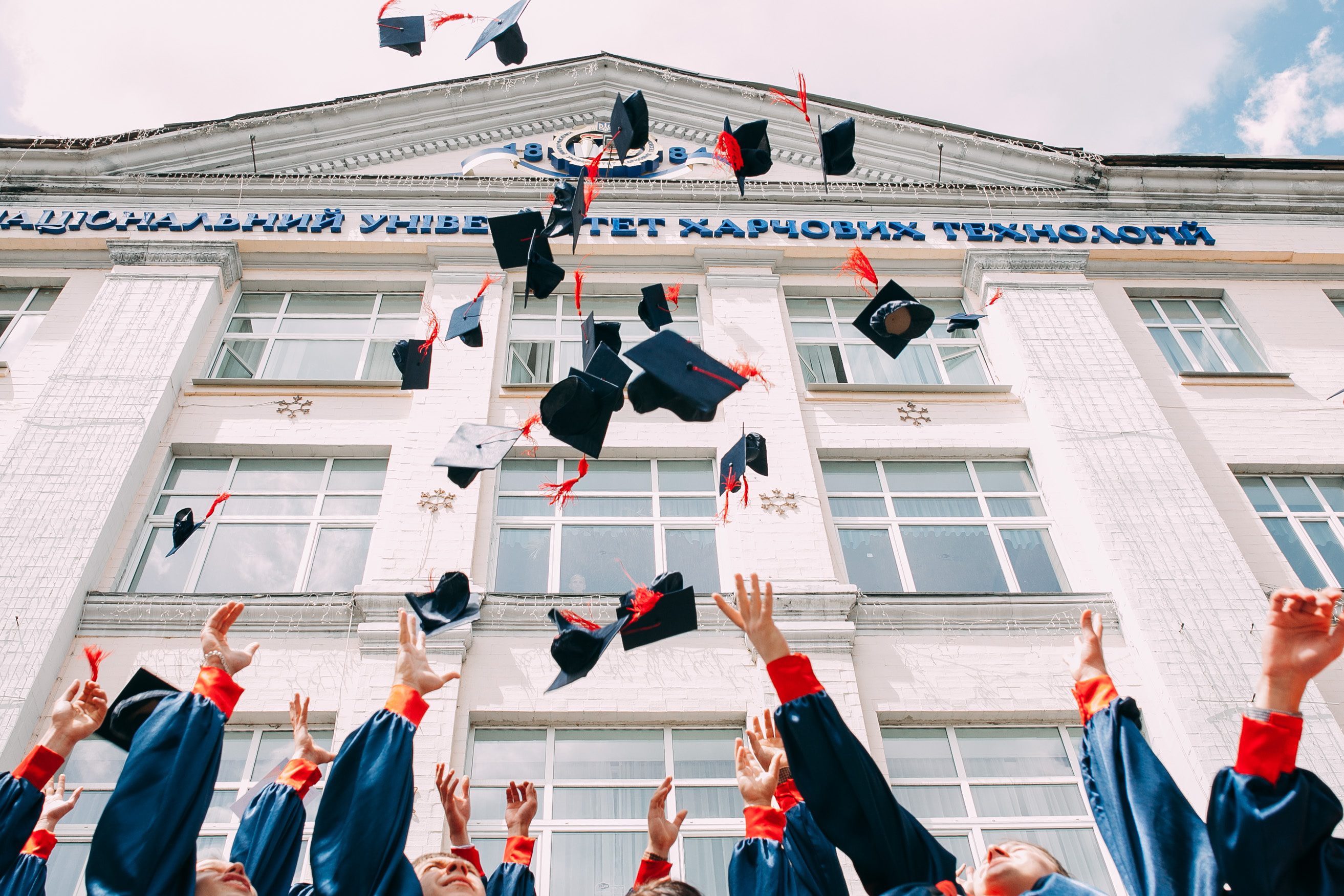 phd academia private sector phd graduates in academia for a job in the private sector throw their caps in the air at graduation