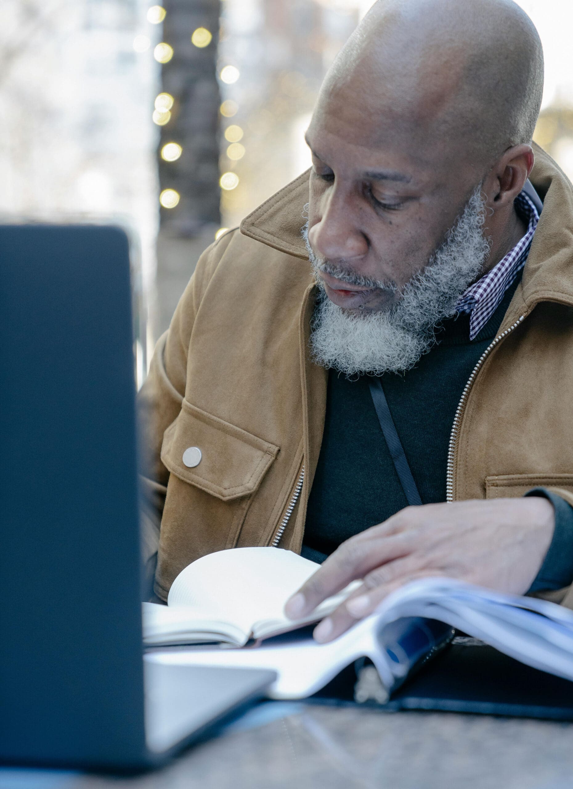 Blackman on laptop and writing revised